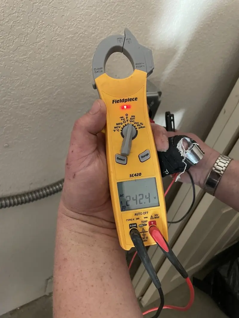 Voltage testing with clamp meter during Recessed Lighting Installation in Germantown Hills